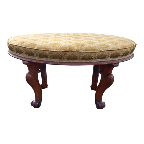 625 - A REGENCY FOOTSTOOL ON  CABRIOLE LEG ON TURNED FOOT WITH A SHAPED OVAL TOP