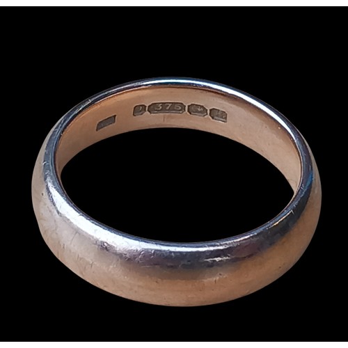 565 - A HEAVY 9ct GOLD BAND RING IN BARREL SHAPE 7.19grm