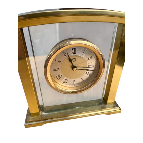 65A - A BRASS AND GLASS MANTLE CLOCK