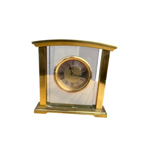 65A - A BRASS AND GLASS MANTLE CLOCK