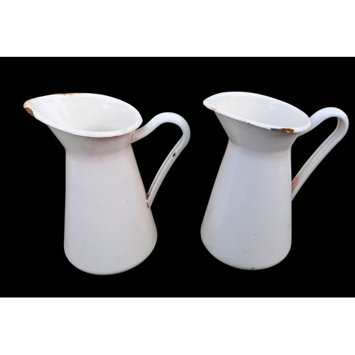 57 - A PAIR OF HEAVY ENAMEL JUGS