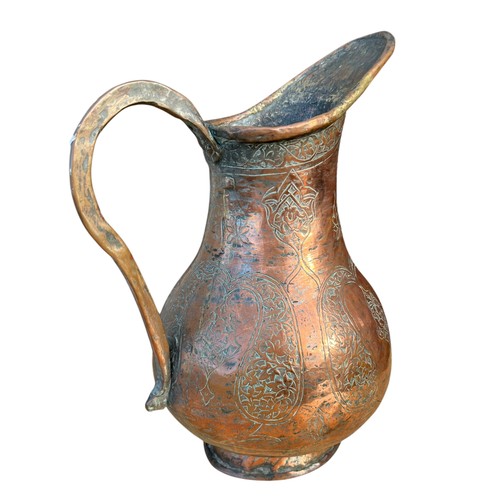 95 - AN ANTIQUE COPPEER JUG 11