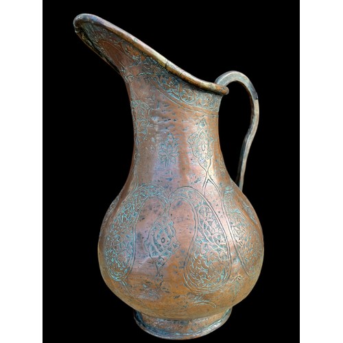 95 - AN ANTIQUE COPPEER JUG 11