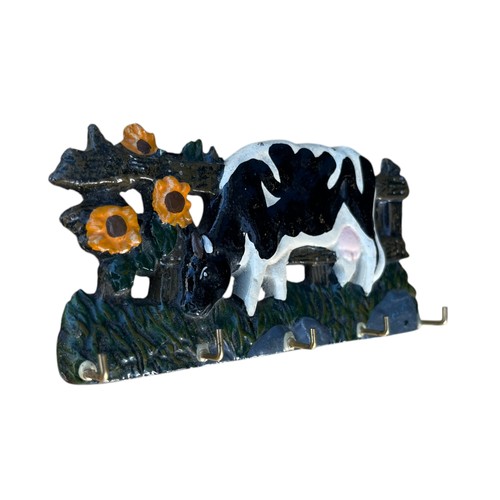 100 - A CAST COW PLAQUE WITH HOOKS