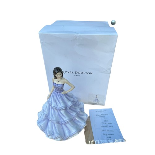 106 - A BOXED ROYAL DOULTON FIGURENE WARM AFFECTION HN5876 AND 16cm TALL