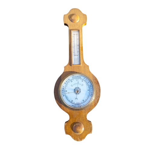 110 - AN OAK FRAMED BAROMETER