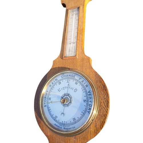 110 - AN OAK FRAMED BAROMETER