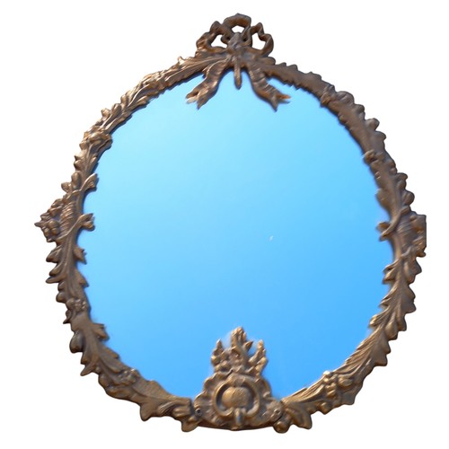 126 - AN ORNATE BRASS FRAMED MIRROR OF NEAT PROPORTION