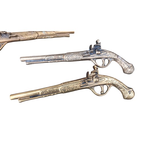 159 - 2 PAIR OF BRASS WALL MOUNTED PISTOLS