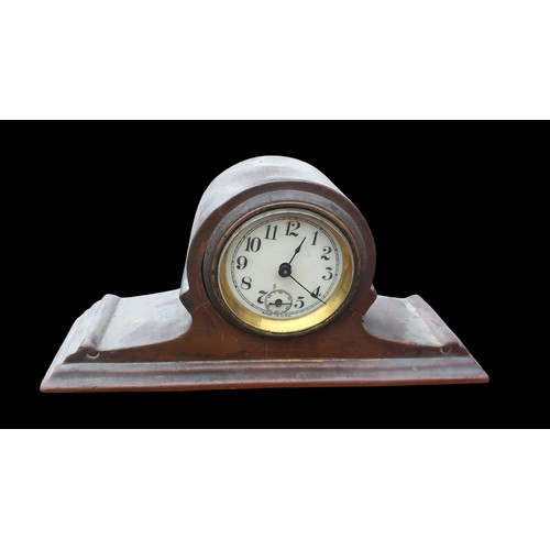 168 - A SMALL ANTIQUE COPPER CLOCK