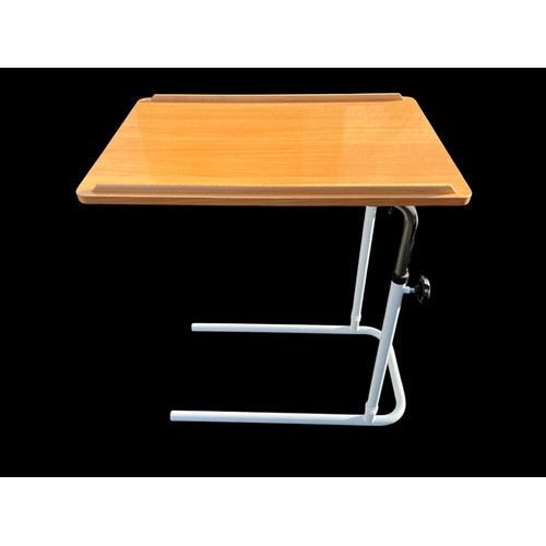 188 - AN ADJUSTABLE BED TABLE