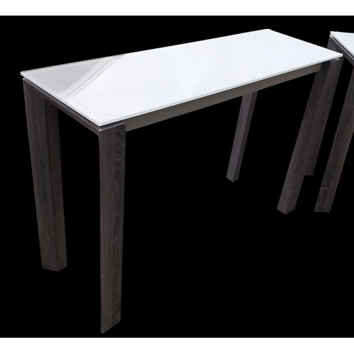 189 - A PAIR OF MODERN GREY GLASS TOPPED CONSOL TABLES