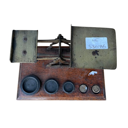 263 - A SET OF MOUNTED SCALES WITH WEIGHTS