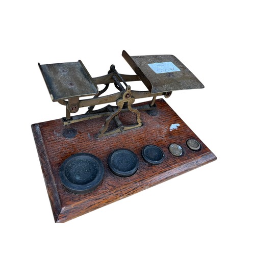 263 - A SET OF MOUNTED SCALES WITH WEIGHTS