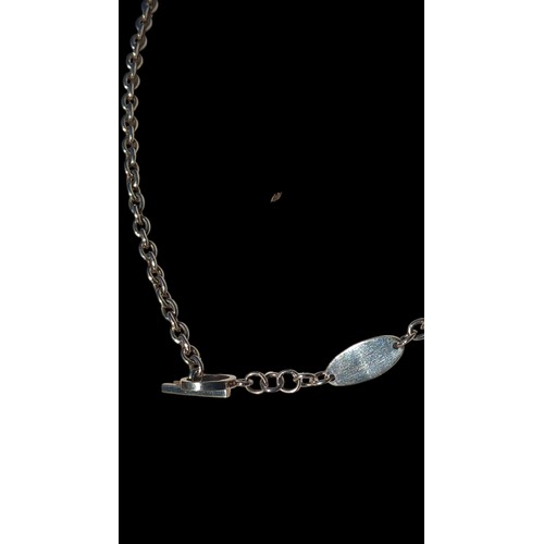 267 - A DESIGNER SILVER PENDANT ON A FANCY LINK T.BAR LINK