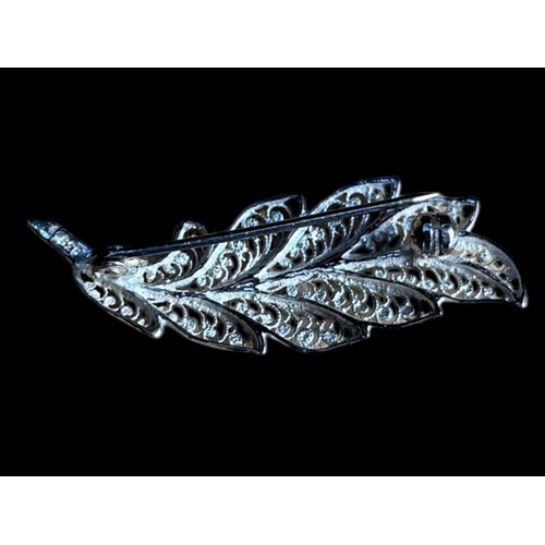 243 - A SILVER LEAF BROOCH