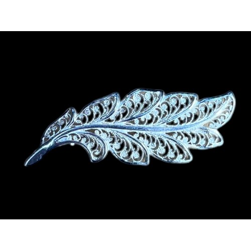 243 - A SILVER LEAF BROOCH