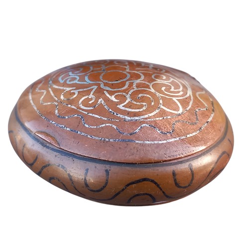 253 - AN ORNATE COPPER PILL BOX WITH MARKINGS