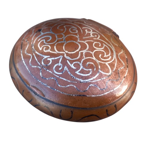 253 - AN ORNATE COPPER PILL BOX WITH MARKINGS