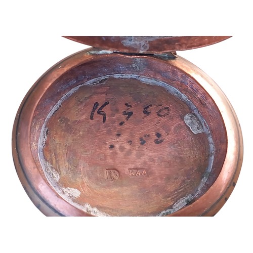 253 - AN ORNATE COPPER PILL BOX WITH MARKINGS