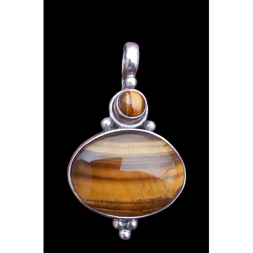 283 - A SILVER TIGERS EYE PENDANT