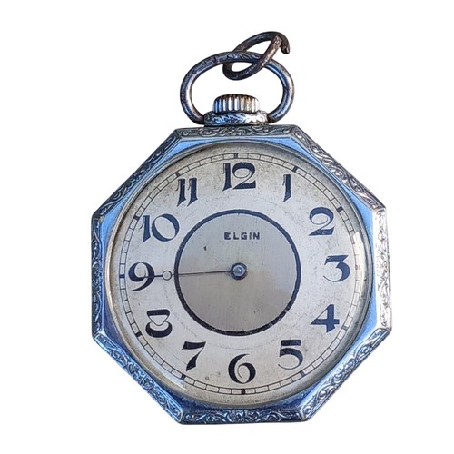 289 - AN ORNATE HEXAGONAL WHITE METAL CASED ELGIN POCKET WATCH (HOUR HAND MISSING)