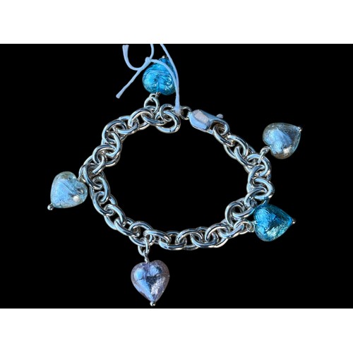 272 - A SILVER BRACELET WITH HEART SHAPED CHARMS