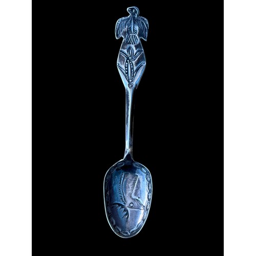 294 - A SILVER SPOON (TESTED) ENGRAVED WITH STAG HEAD AND AN EMBOSSED EAGLE TO TOP 11G