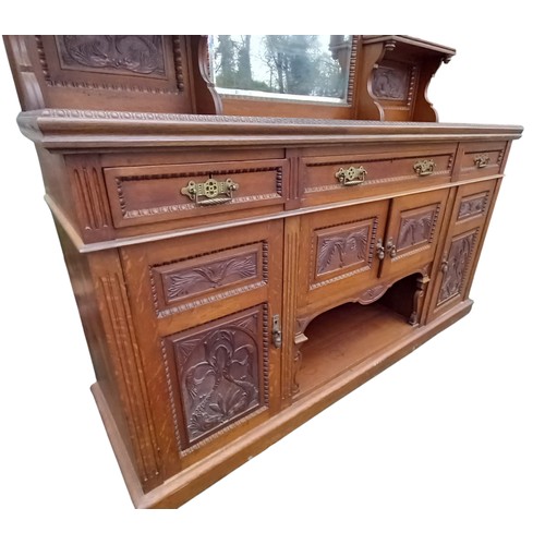 1 - A LARGE ANTIQUE OAK 3 DRAWER 4 DOOR  SIDEBOARD WITH A 3 BEVELLED MIRROR BACK