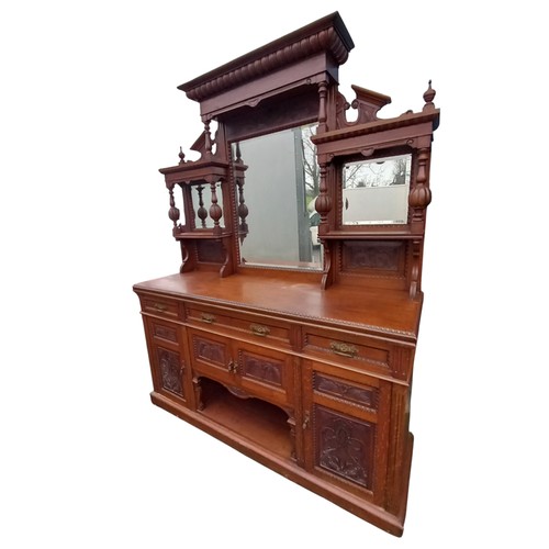 1 - A LARGE ANTIQUE OAK 3 DRAWER 4 DOOR  SIDEBOARD WITH A 3 BEVELLED MIRROR BACK