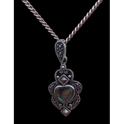 180 - A SILVER ABOLONE MARCASITE PENDANT ON A SILVER CHAIN