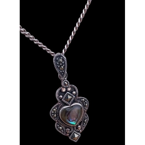 180 - A SILVER ABOLONE MARCASITE PENDANT ON A SILVER CHAIN