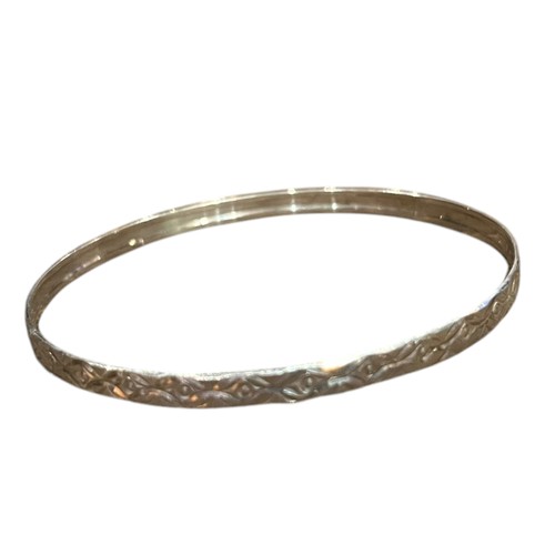 213 - AN ORNATE SILVER BANGLE