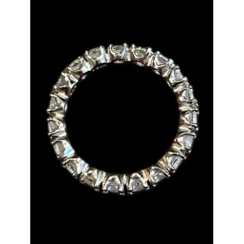 214 - A LOVELY SILVER ETERNITY RING SET WITH BRIGHT CZ STONES