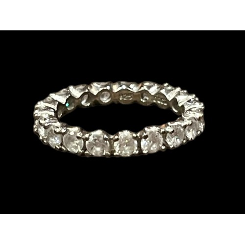 214 - A LOVELY SILVER ETERNITY RING SET WITH BRIGHT CZ STONES