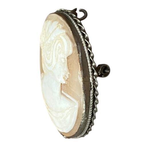 224 - A SMALL MOUNTED CAMEO BROOCH PENDANT WITH SCROLL EDGED DESIGN