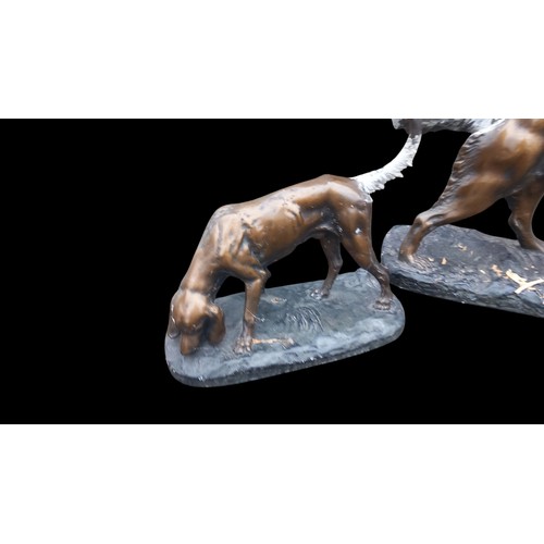 366 - 3 CHALK DOGS OF VARIOUS SIZES (IN A CONVINCING BRONZE FINISH)