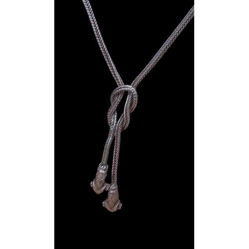 240 - A DESIGNER SILVER NECKLACE WITH KNOT DESIGN AND REM HEADS TO THE DROPS 14.8g