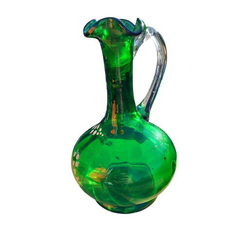 388 - AN ANTIQUE HAND PAINTED GREEN GLASS EWER AND JUG