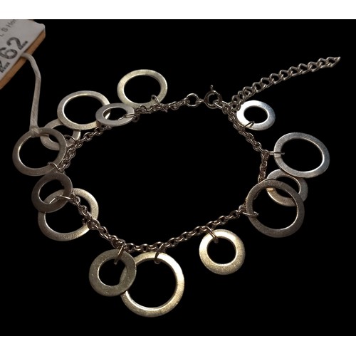 262 - A SILVER BRACELET SET WITH SILVER CIRCLES