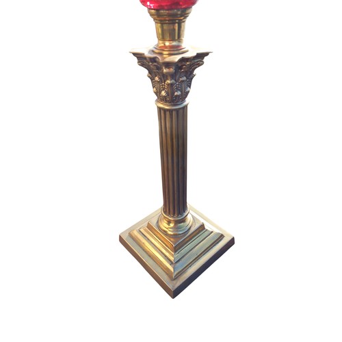 340 - A VICTORIAN RUBY BOWL OIL LAMP WITH DUPLEX DOUBLE BURNER ON A GOOD BRASS CORINTHIAN PILLAR