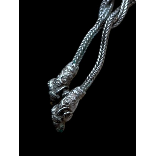 240 - A DESIGNER SILVER NECKLACE WITH KNOT DESIGN AND REM HEADS TO THE DROPS 14.8g