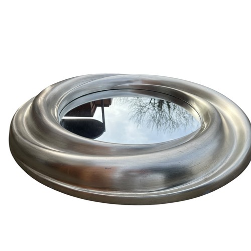 56 - A CIRCULAR SWIRL MIRROR IN A SILVER FINISH APPROX 36