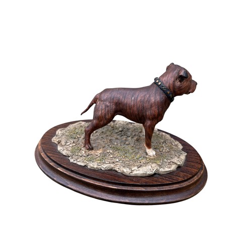 132 - A COUNTRY ARTISTS STAFFORDSHIRE BULL TERRIER ON WOODEN BASE 8X5