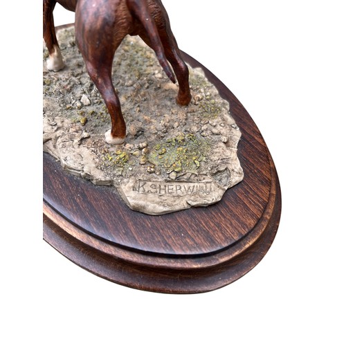 132 - A COUNTRY ARTISTS STAFFORDSHIRE BULL TERRIER ON WOODEN BASE 8X5