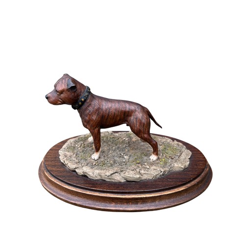 132 - A COUNTRY ARTISTS STAFFORDSHIRE BULL TERRIER ON WOODEN BASE 8X5