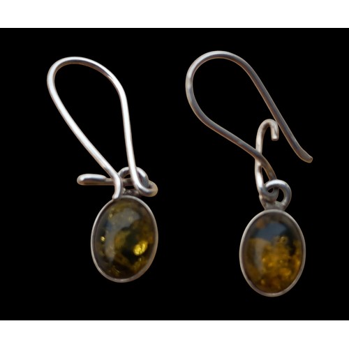 144 - A PAIR OF AMBER SET SILVER EARRINGS