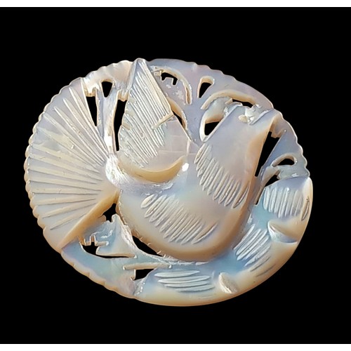 159 - A MOTHER OF PEARL CARVED DOVE BROOCH