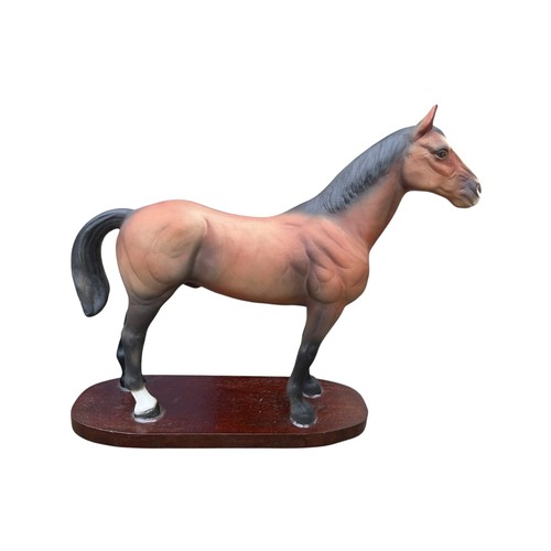 168 - A LARGE 28CM x 32CMS CERAMIC MATTE FINISHED STALLION ON A WOODEN PLINTH