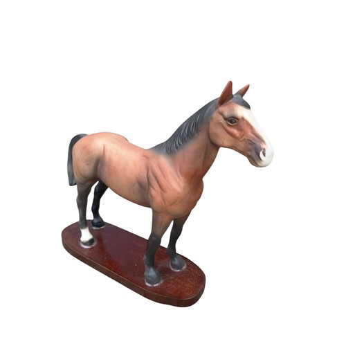 168 - A LARGE 28CM x 32CMS CERAMIC MATTE FINISHED STALLION ON A WOODEN PLINTH